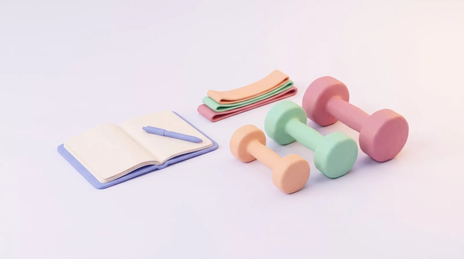 Three progressively heavier dumbbells beside a notebook for tracking strength progress.